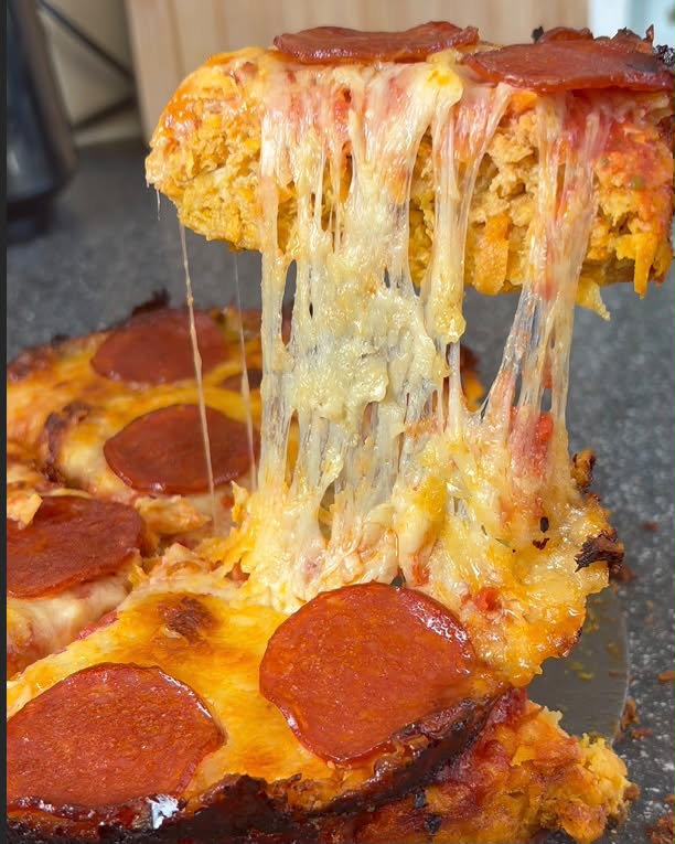 Sweet potato crust pepperoni pizza with cheese pull