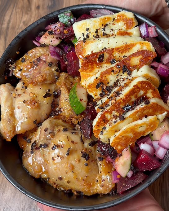 Chicken thigh and halloumi bowl with beetroot and cucumber salad